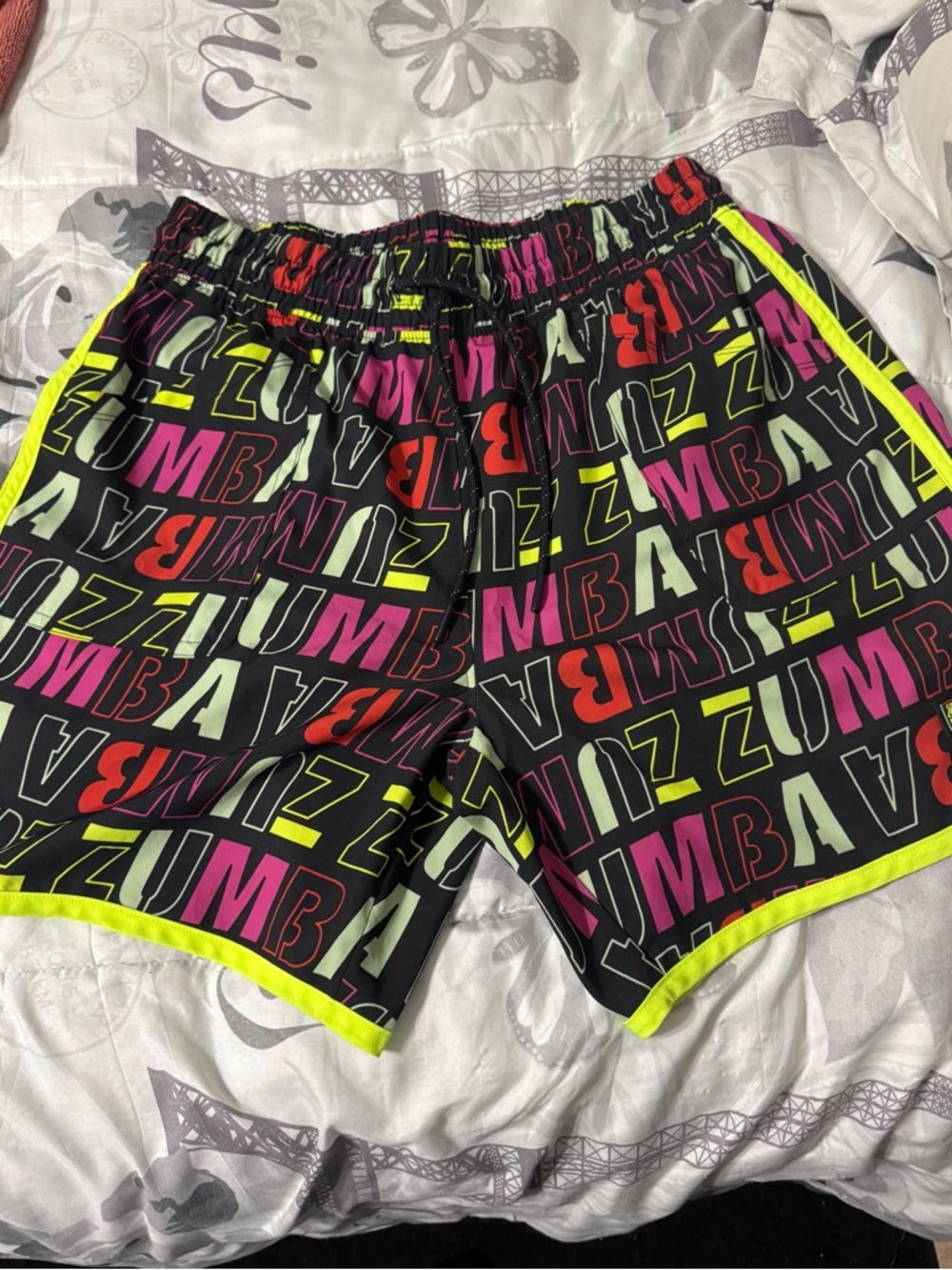 Zumba Fitness Black Shorts with Neon Yellow Trim and Multicolor Logo Print
